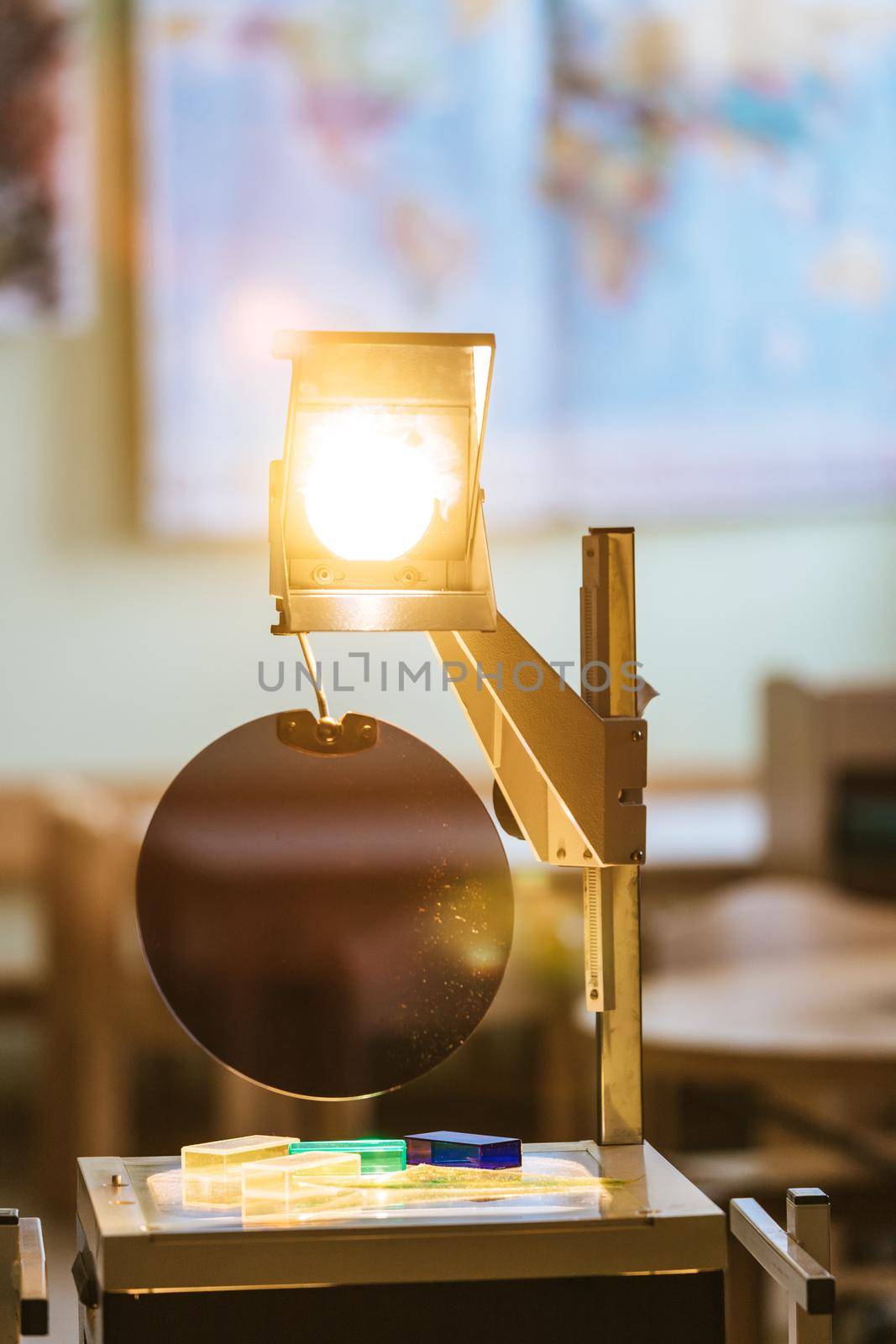 Schooling concept: Retro overhead projector in classroom, educational system by Daxenbichler