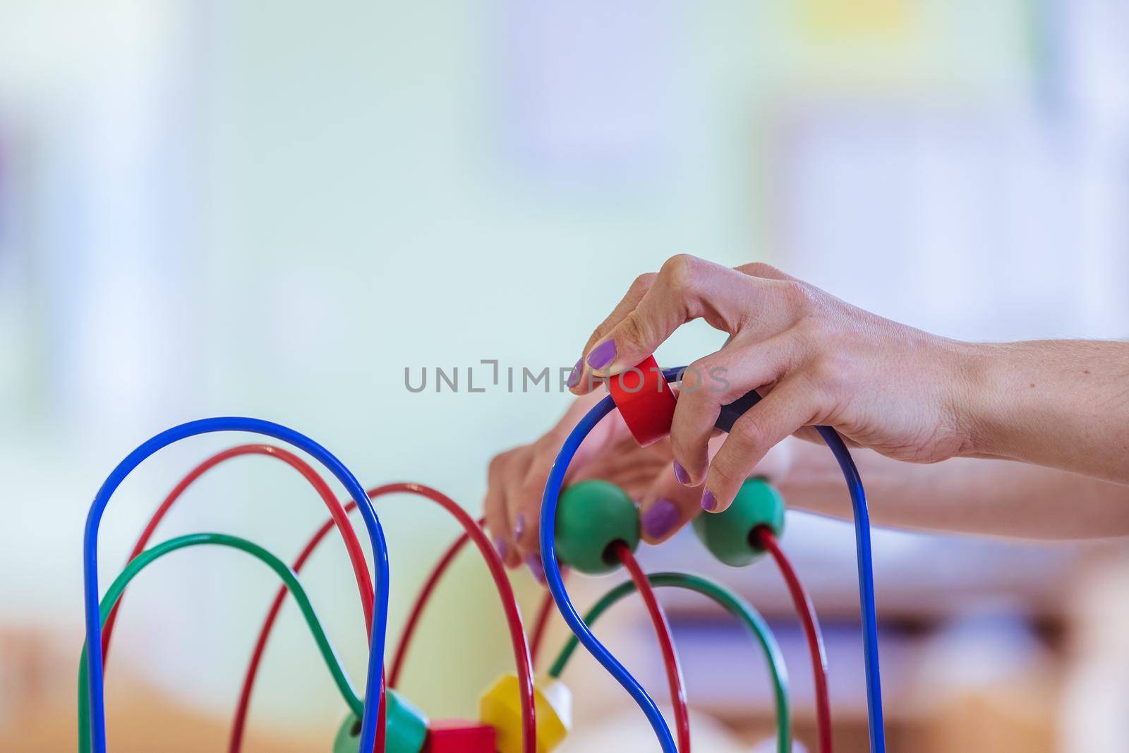 Close up of colorful wooden toy for learning and socialization
