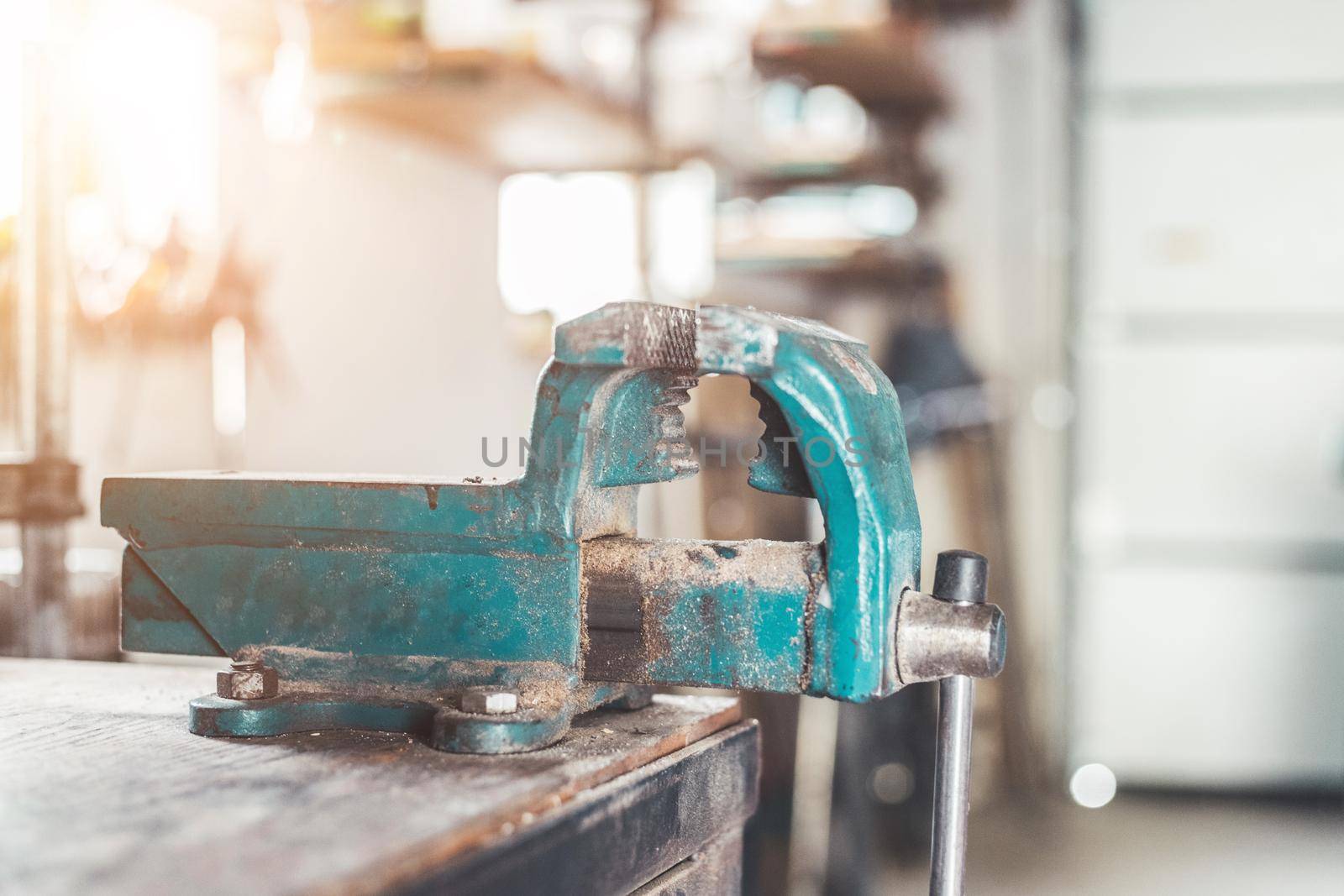 Close up of a metal vice in a garage workshop