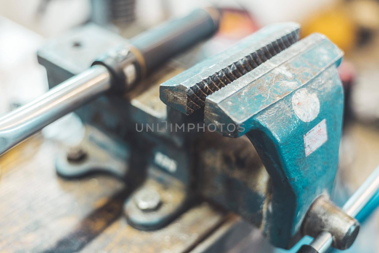 Close up of a metal vice in a garage workshop