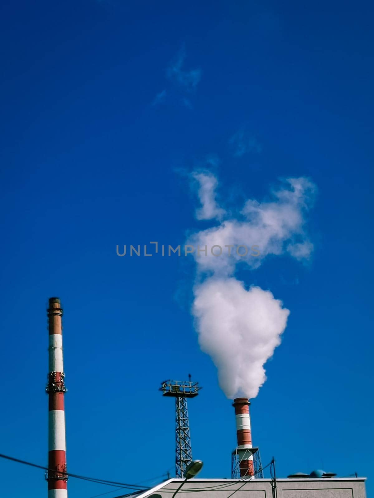 Vertical shot of smoke pipe - air pollution concept by wektorygrafika