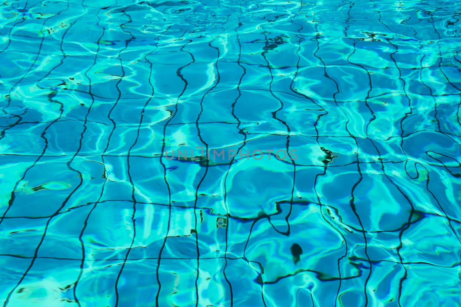 Blue and bright water in a swimming pool with sun reflection by wektorygrafika