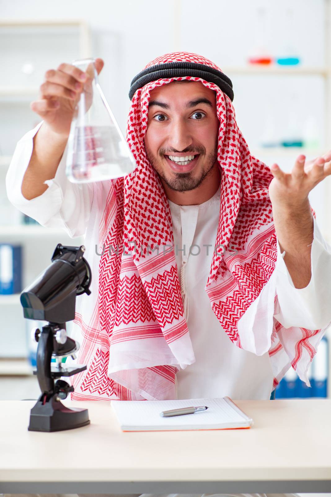 Arab chemist checking the quality of drinking water