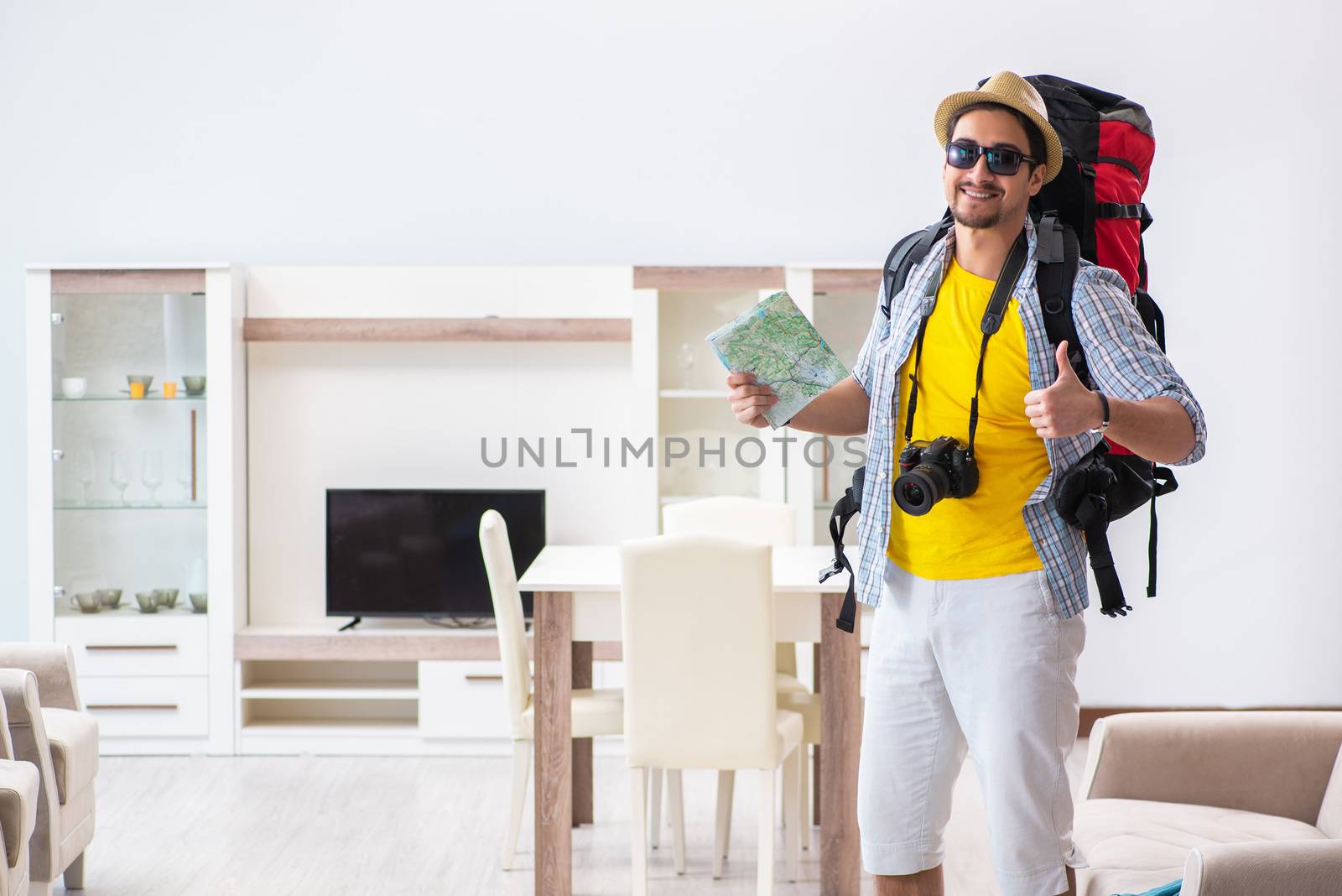 Man planning his travel with map