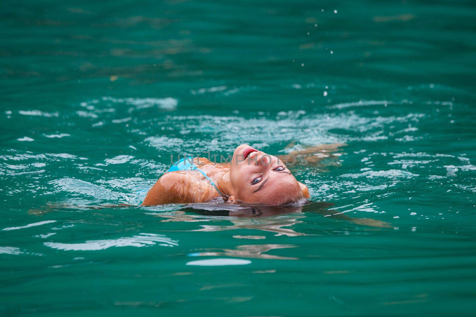 Girl relaxing in sea water by Yellowj