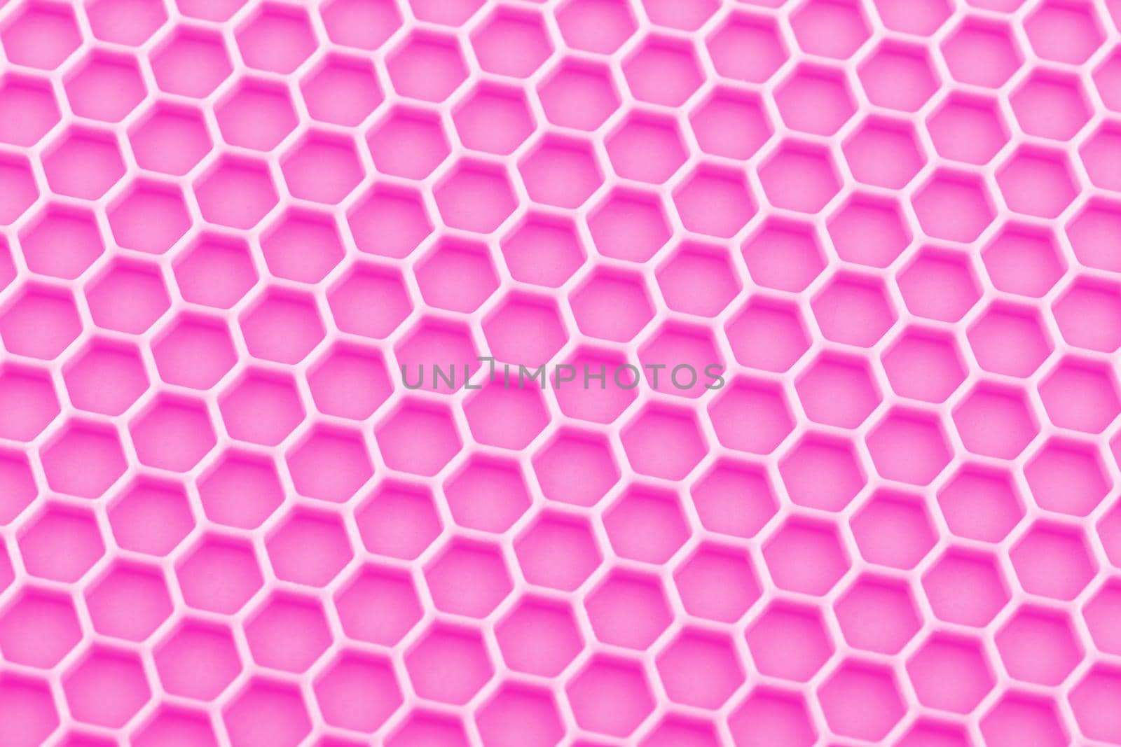 abstract pink honeycomb close-up unobtrusive photo background.