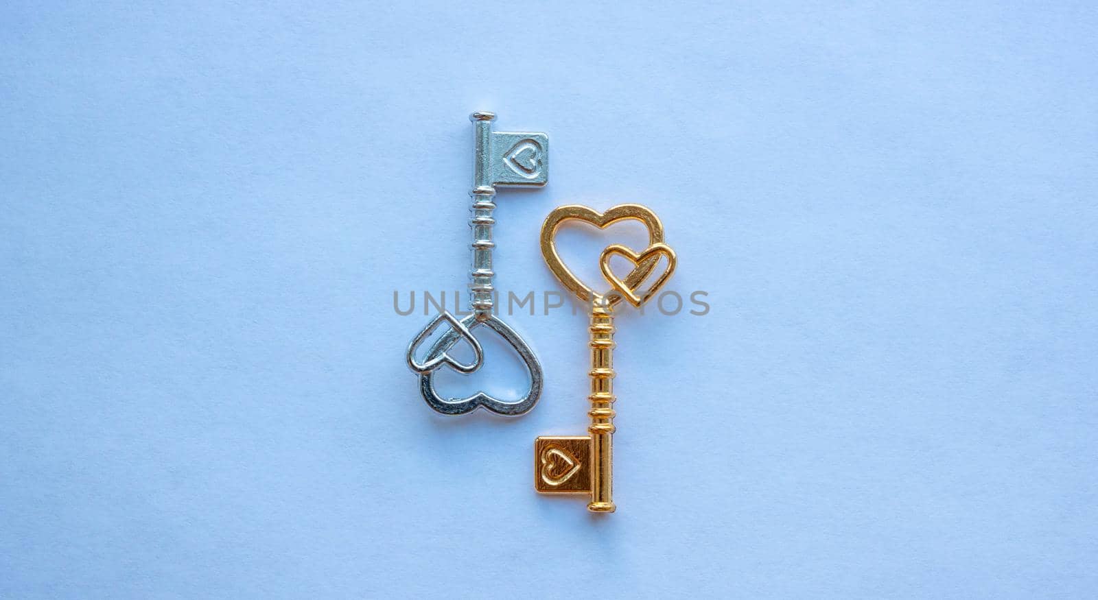 Gold and silver keys isolated on a white background.