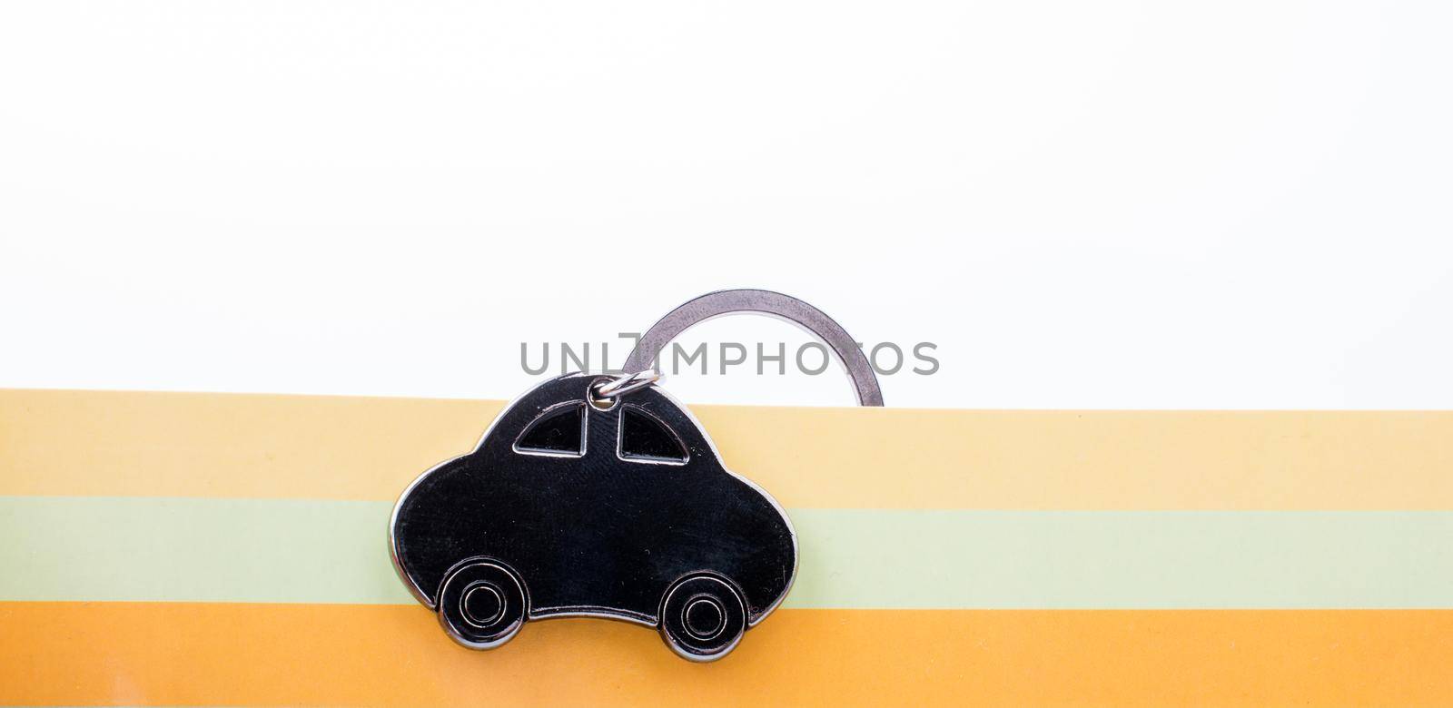 automobile business concept with a metal car icon on colorful background