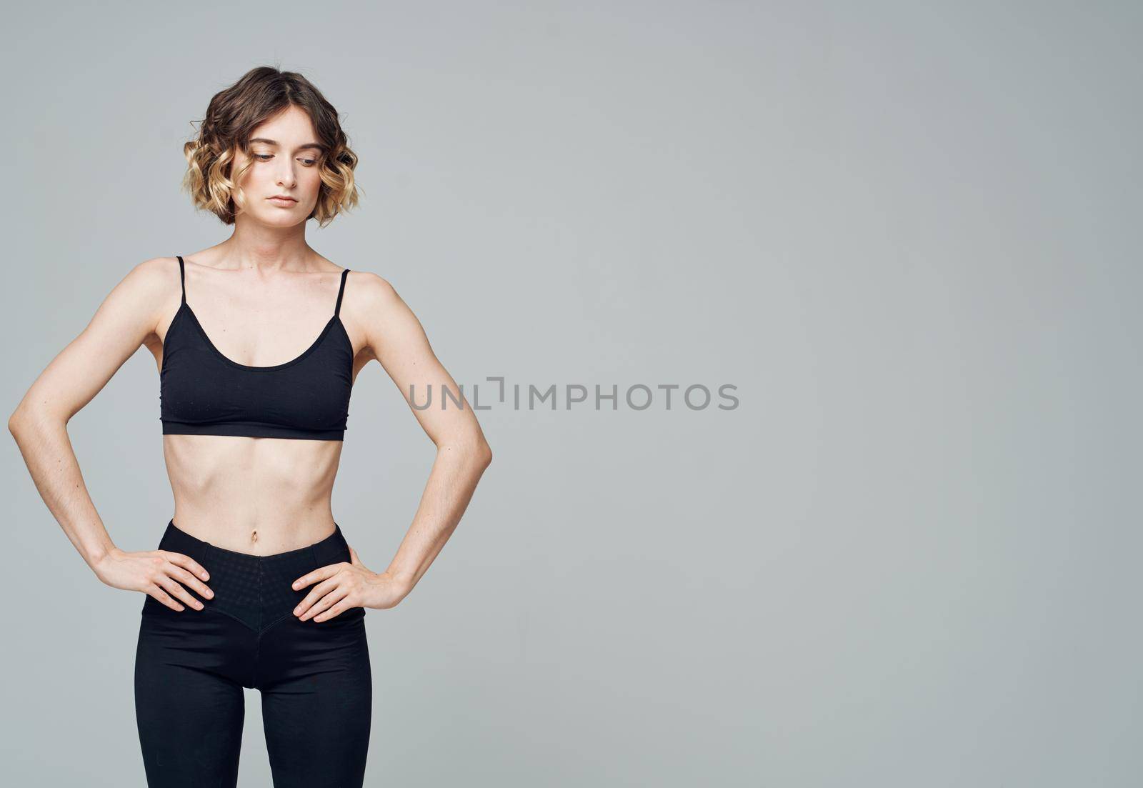 beautiful woman in black leggings is engaged in fitness Copy Space. High quality photo