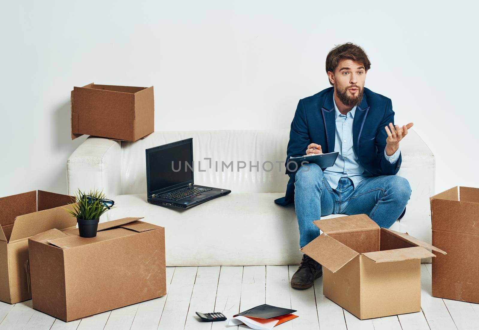 Business man in office suit boxes with things moving laptop technology . High quality photo