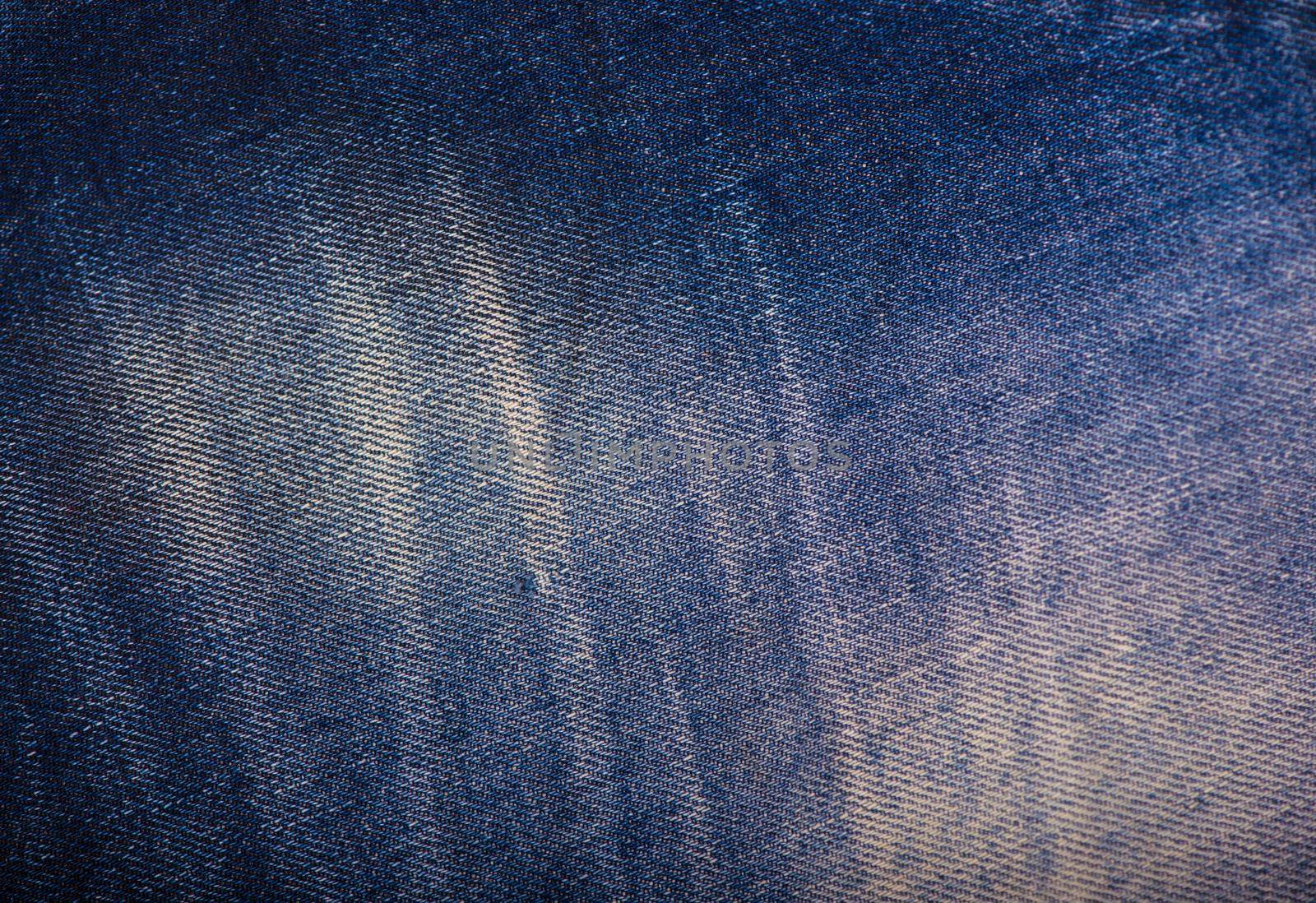 Texture of blue jeans background, ripped jeans by aprilphoto