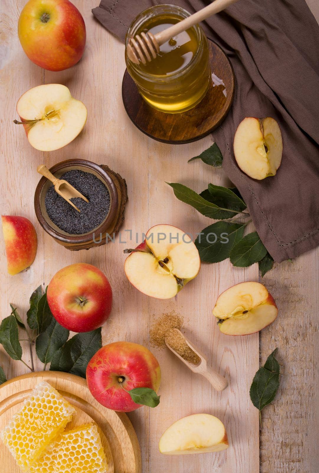 Jewish holiday Rosh Hashana background with apples and honey on blackboard. View from above. Flat lay by aprilphoto