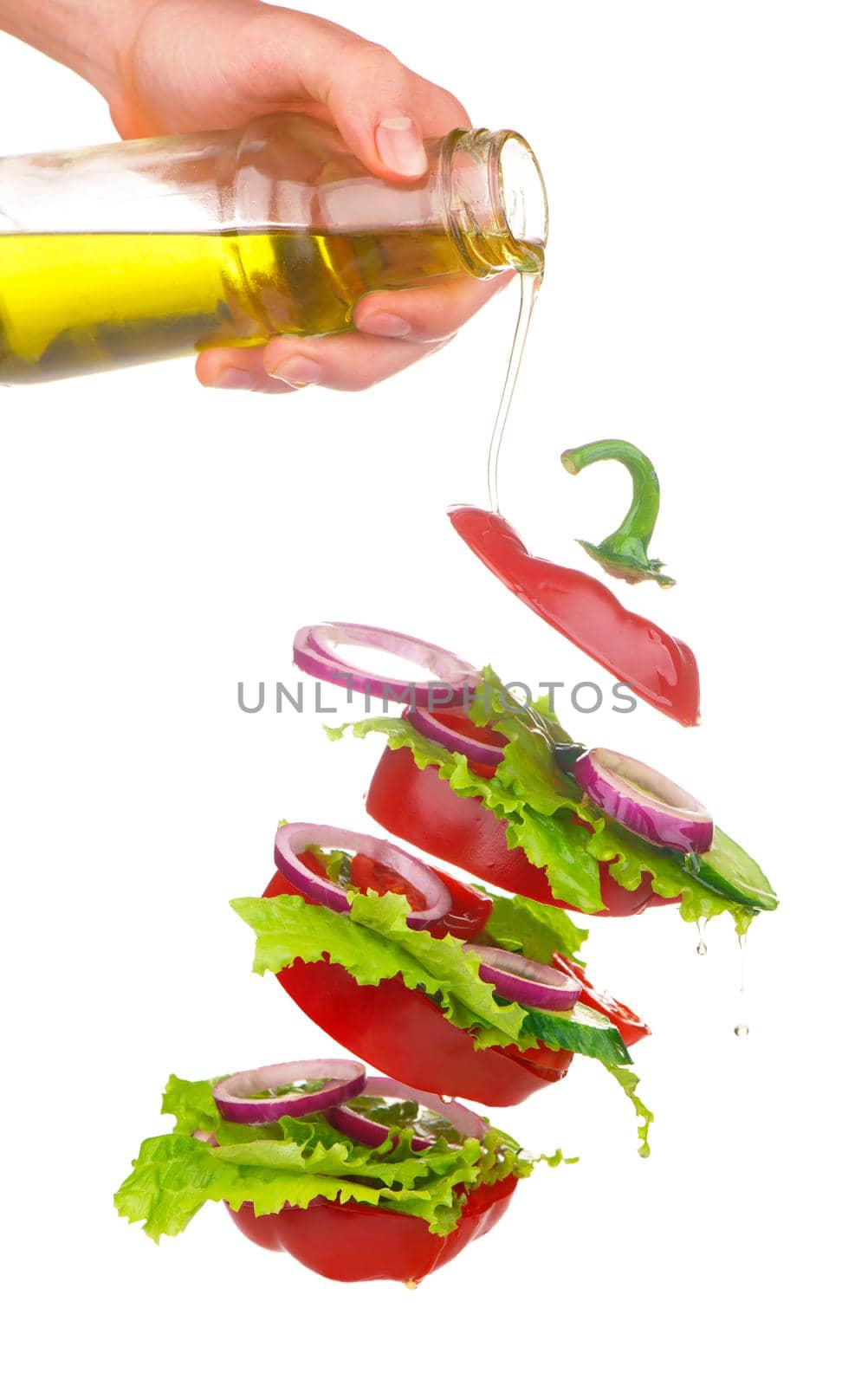 Creative layout made of tomato, bell pepper, cucumber and salad leaves mix