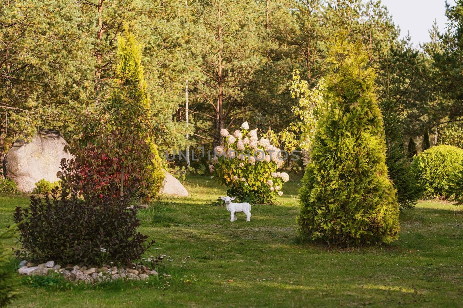 Figurine of a sheep in the garden