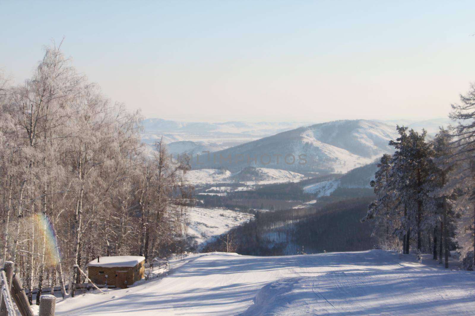 Winter snow mountain landscape with pine trees at ski resort Abzakovo region, Russia, sunny day