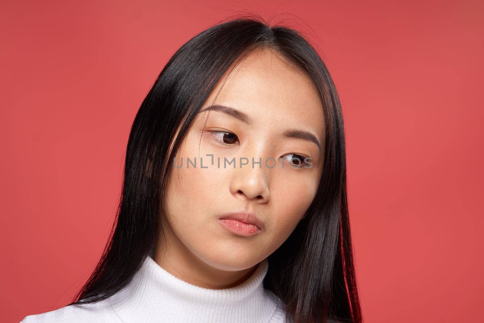 pretty woman asian appearance white sweater emotions red background by SHOTPRIME