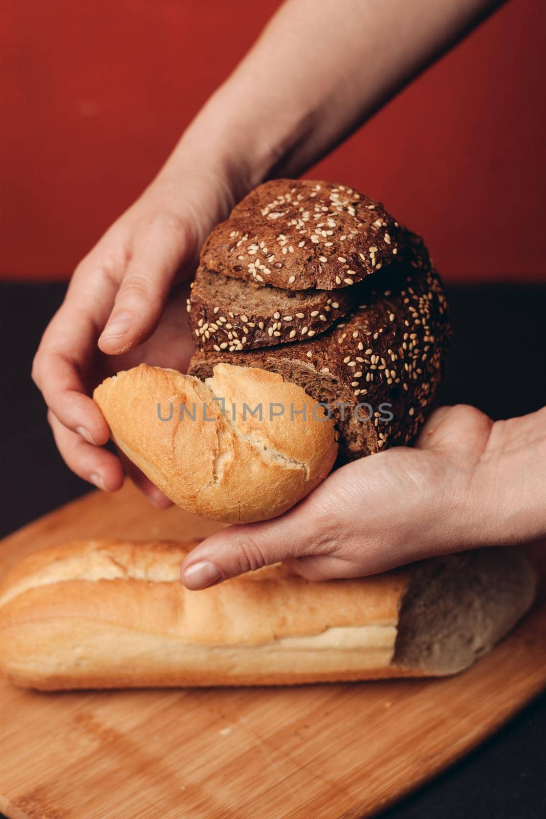 flour products in female hands and sliced baguette on a board. High quality photo