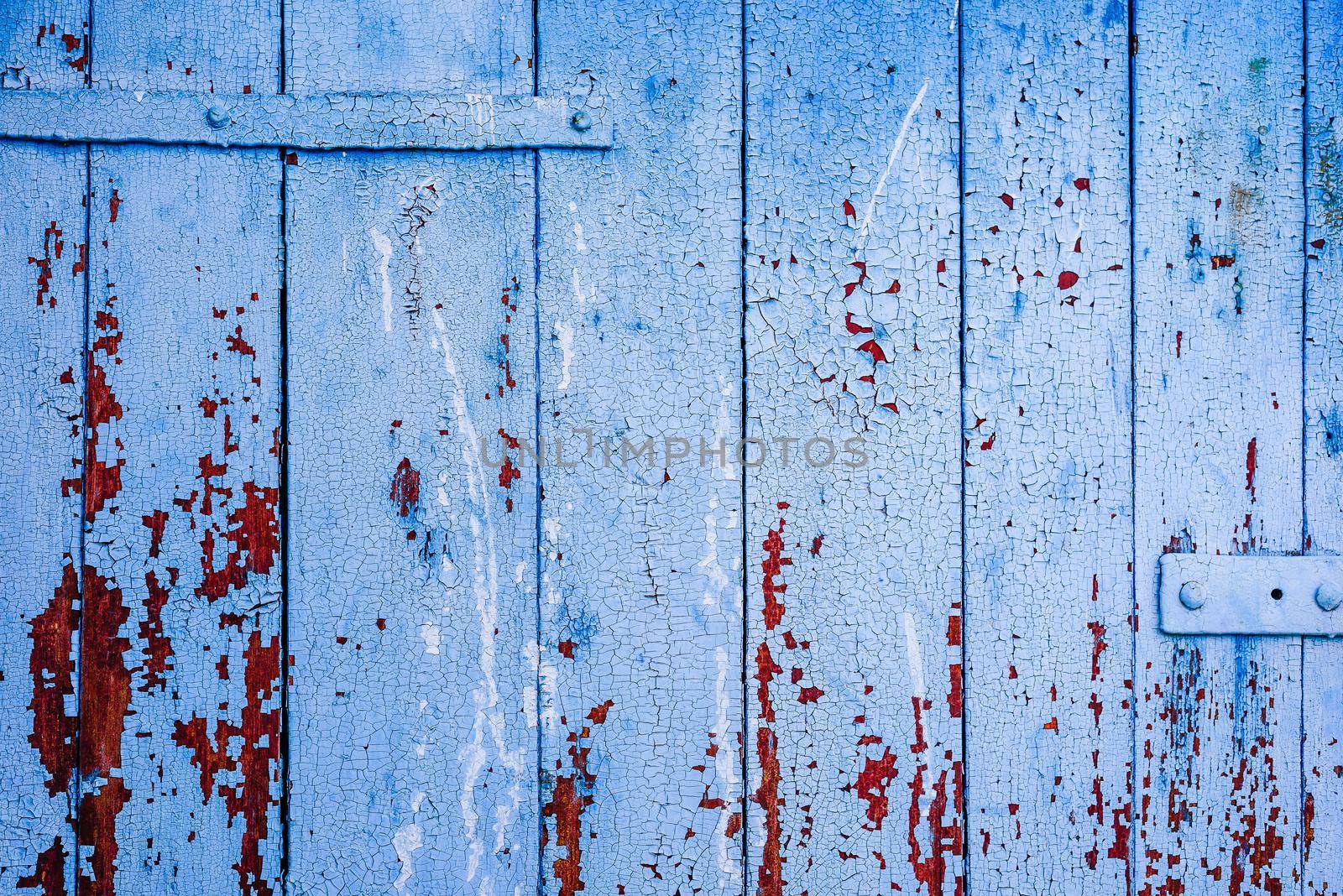 Background of blue painted and rustic wooden surface