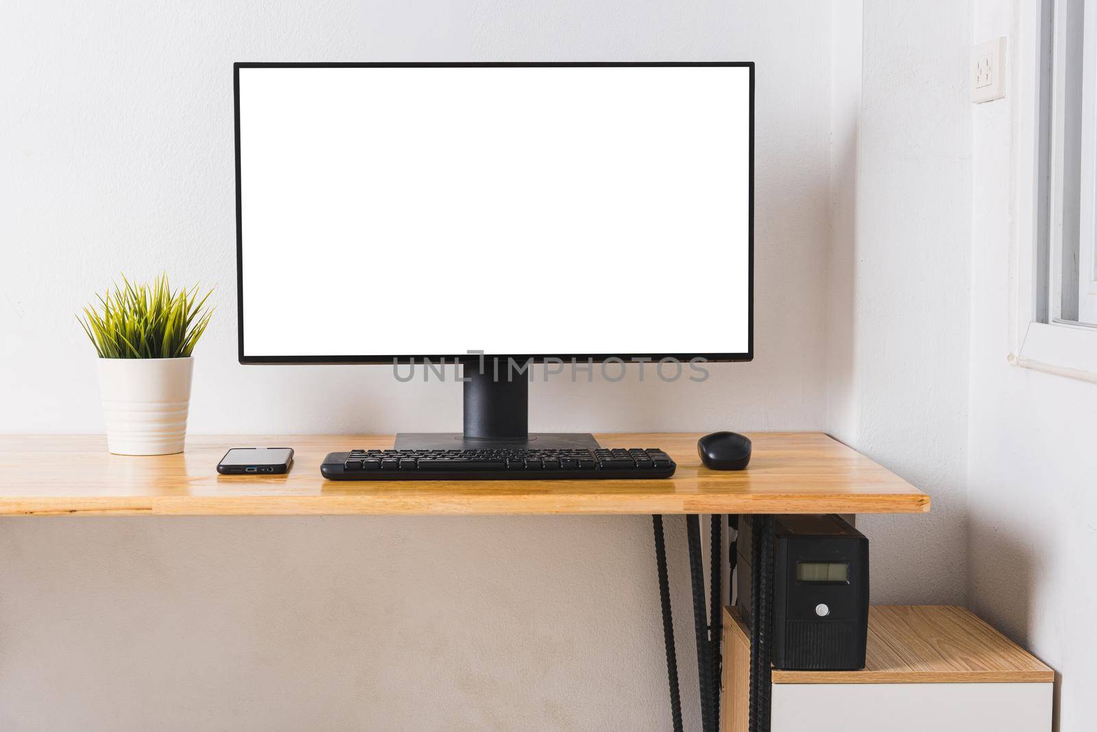 Computer monitor with white blank screen on the business desk by Sorapop