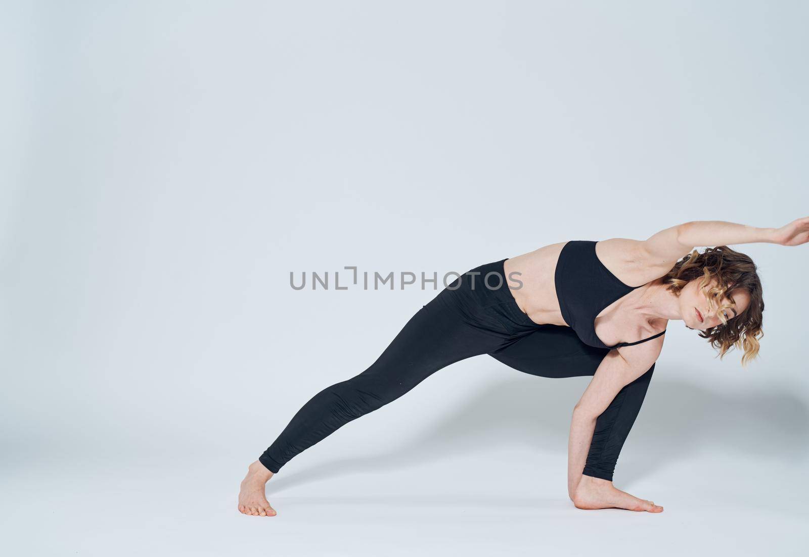 Exercises slim woman yoga asana light background meditation model by SHOTPRIME