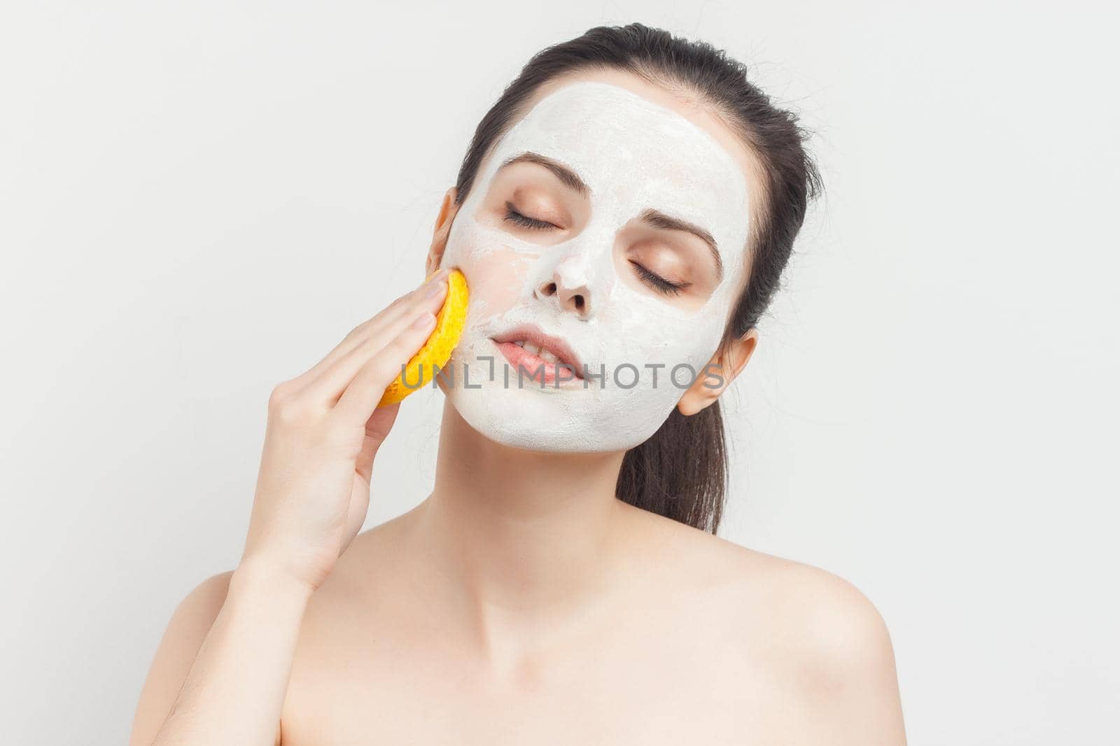 woman holding sponges in hands removing makeup. High quality photo
