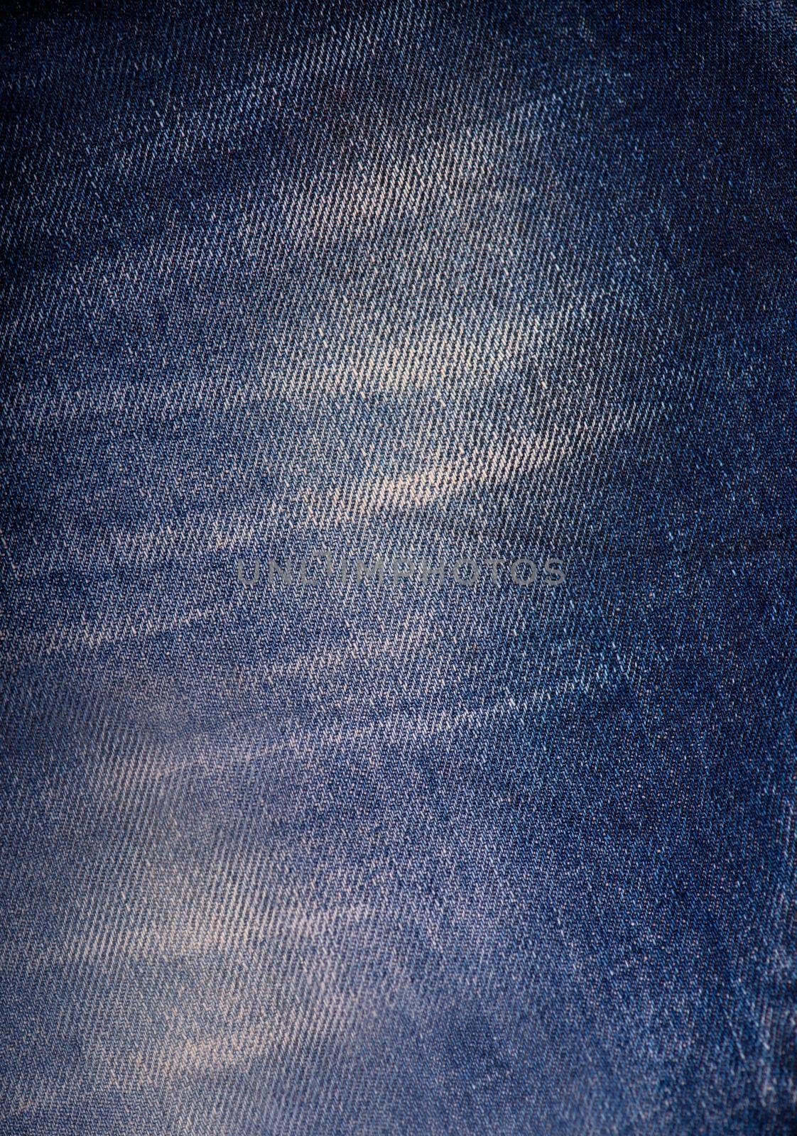 Texture of blue jeans background, ripped jeans by aprilphoto