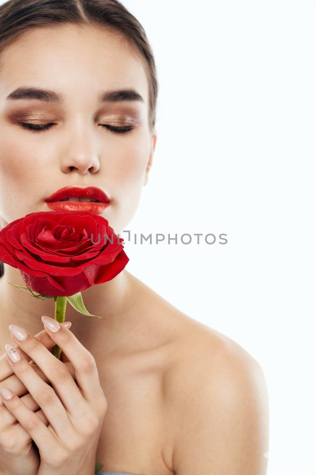 Charming people with bare shoulders red rose makeup eyeshadow. High quality photo