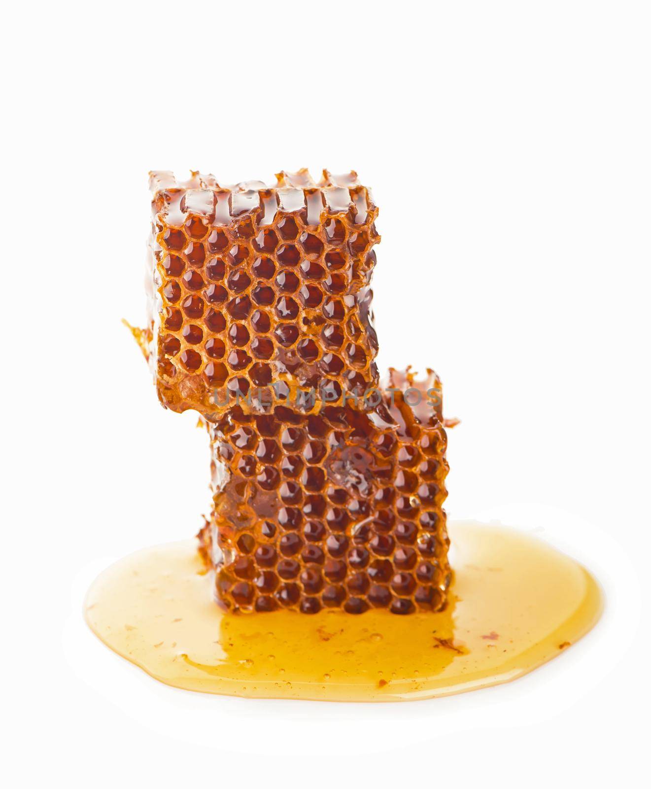 Honeycomb piece. Honey slice isolated on white background. Package design element by aprilphoto