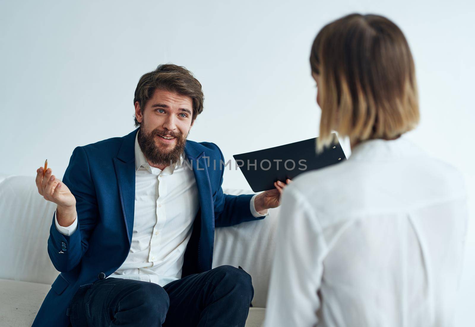 Men and women in suits of colleagues at work office communicating. High quality photo