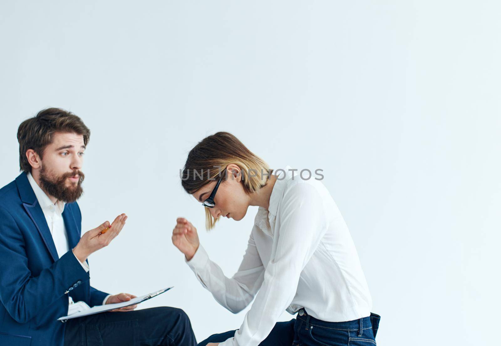 Business men and women sit on the couch communicating employees psychology . High quality photo