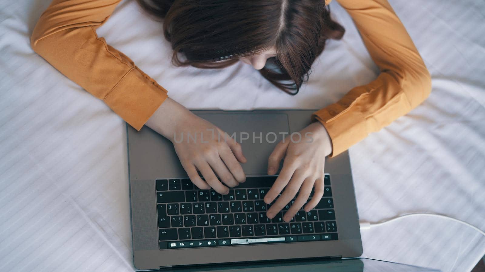 female hands typing text on laptop keyboard close-up. High quality photo