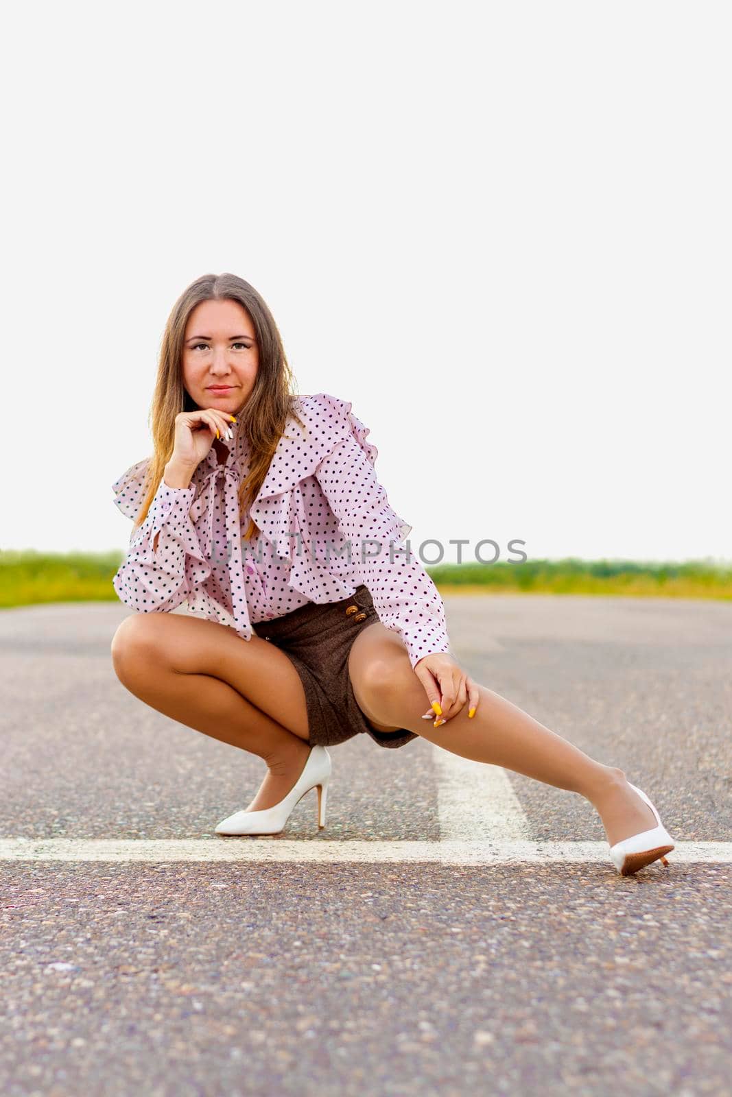 A girl sitting on runway. Perspective in distance. A gloomy summer day. by Essffes