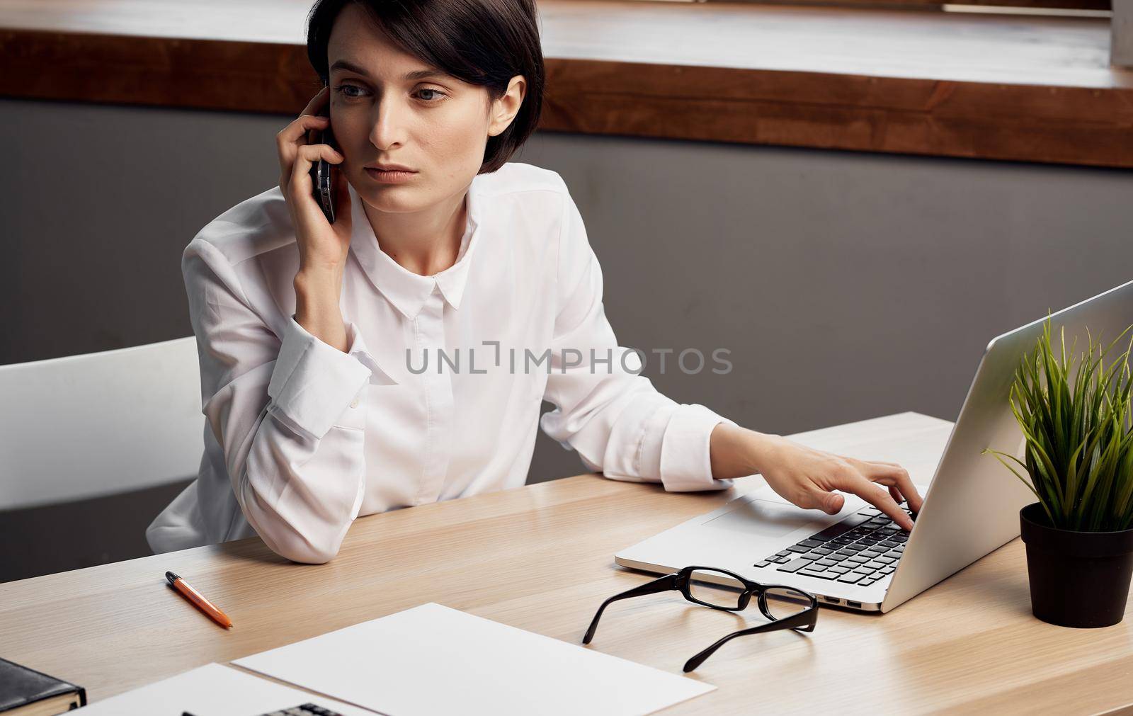 Business woman working desk laptop internet technology professional. High quality photo