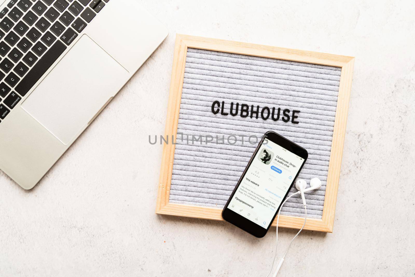Belorechensk, Russia - March 1, 2021: Clubhouse application view on smartphone, letterboard with words Clubhouse by Desperada