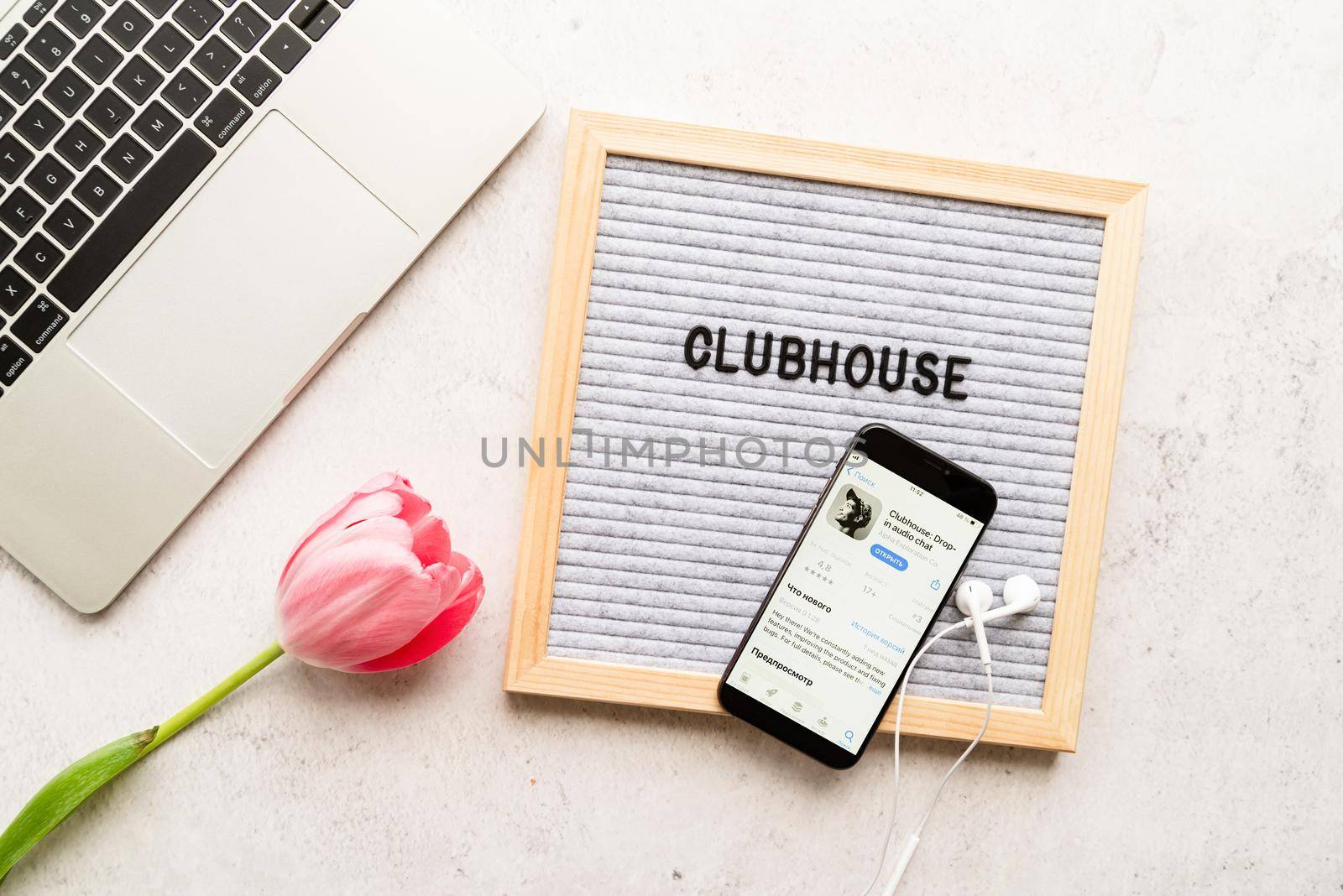 Belorechensk, Russia - March 1, 2021: Clubhouse application view on smartphone, letterboard with words Clubhouse by Desperada