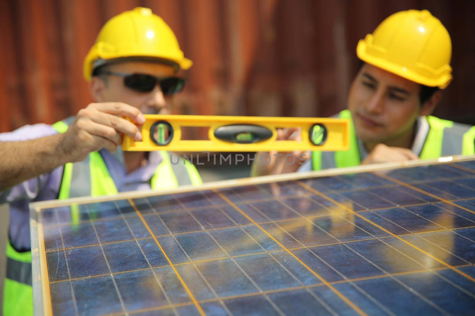 technicians install panels Solar cells to produce and distribute electricity. Energy technology concept