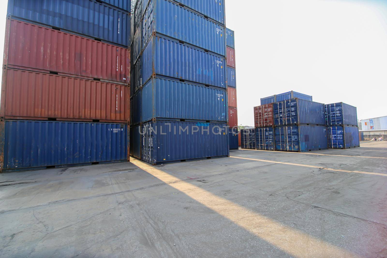 Foreman control loading Containers box from Cargo freight ship for import export. Container Warehouse Worker