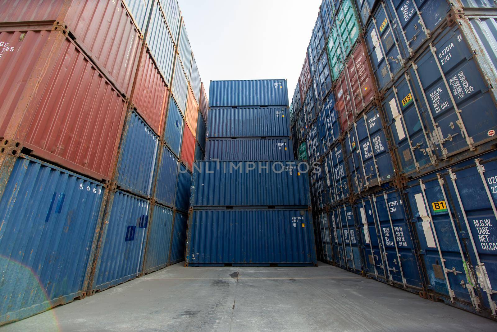 Containers box from Cargo at harbor.Foreman control Industrial Container Cargo freight ship at industry.Transportation and logistic concept.