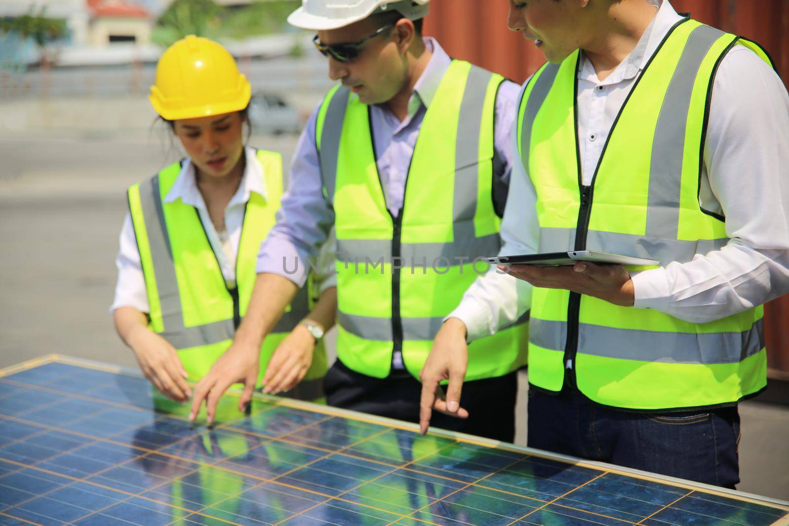 Male worker is installingsolar panel, technician installing solar panels on roof. Alternative energy sun energy power, ecological concept. 