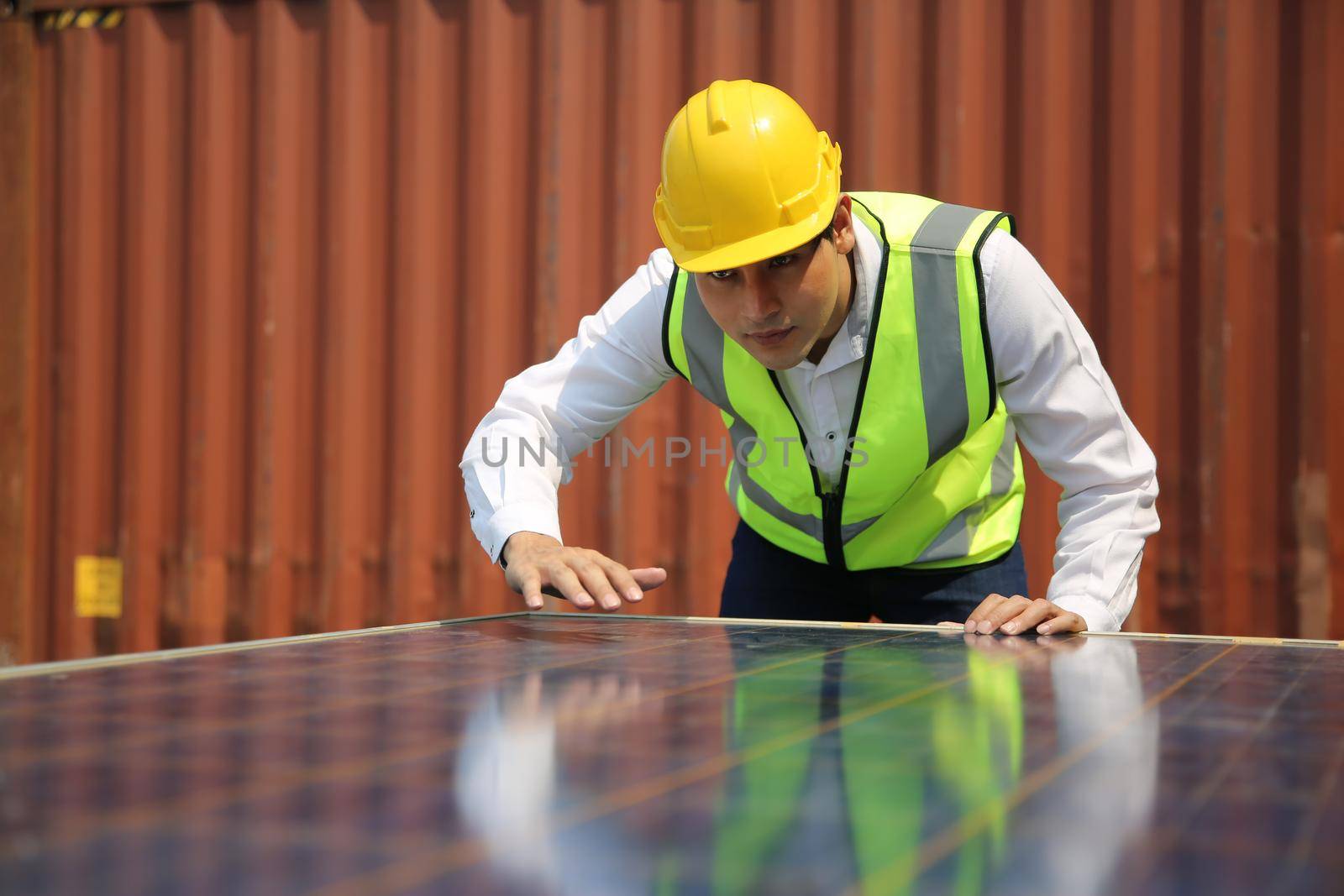 Male worker is installingsolar panel, technician installing solar panels on roof. Alternative energy sun energy power, ecological concept. 