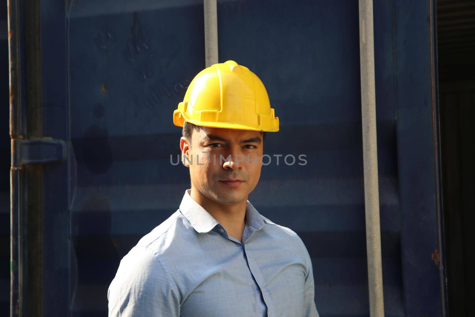 Foreman control loading Containers box from Cargo freight ship for import export.