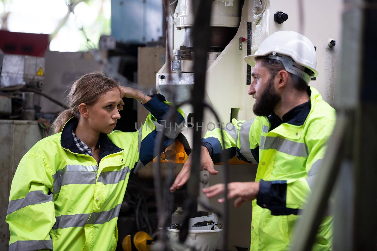 Portrait woman worker and engineer under inspection and checking production process on factory station by chuanchai