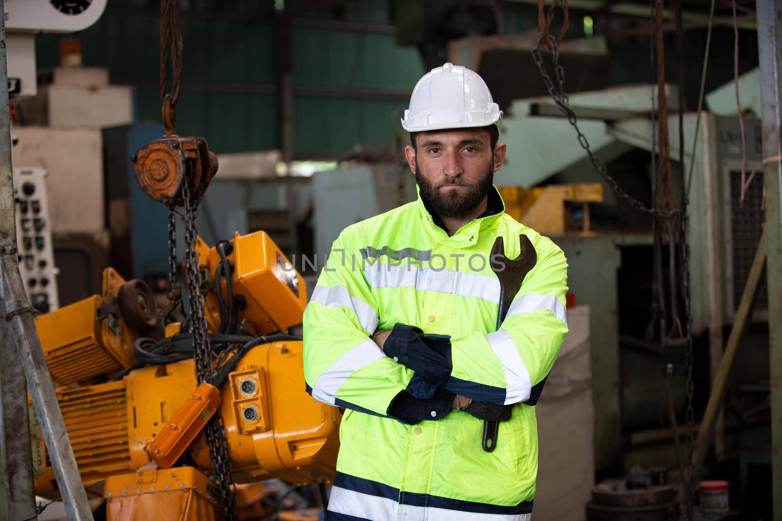workers helmets at the factory, workers in the factory, people go in helmets and uniforms for an industrial enterprise