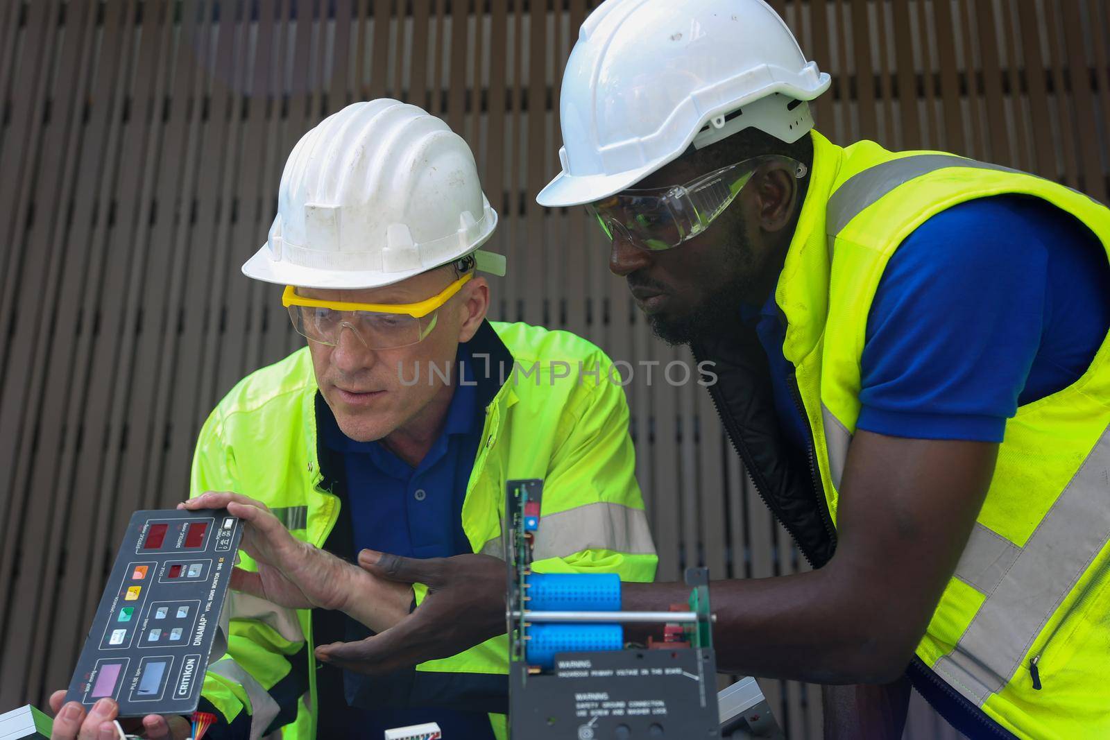 maintenance engineer, Solar energy systems engineer perform analysis solar panels, Portrait of engineer man or worker, people, with solar panels or solar cells on the roof in farm. Power plant with green field, renewable energy source in American. Eco technology for electric power.