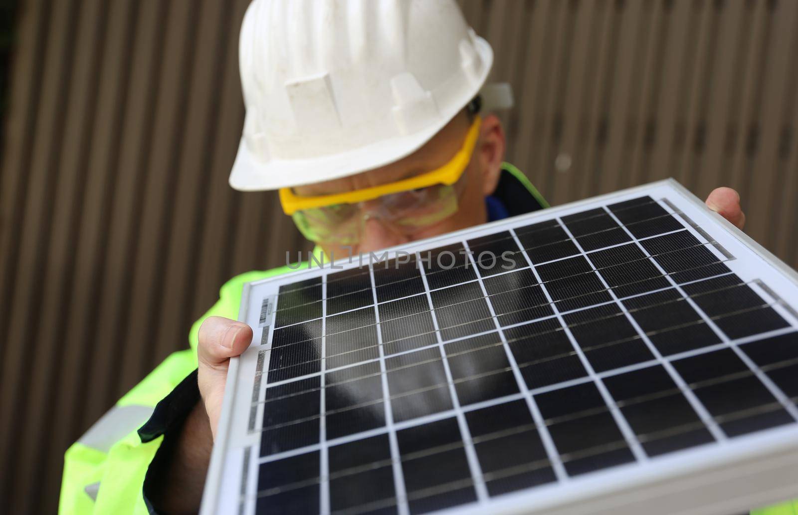 maintenance engineer, Solar energy systems engineer perform analysis solar panels, Portrait of engineer man or worker, people, with solar panels or solar cells on the roof in farm. Power plant with green field, renewable energy source in American. Eco technology for electric power.