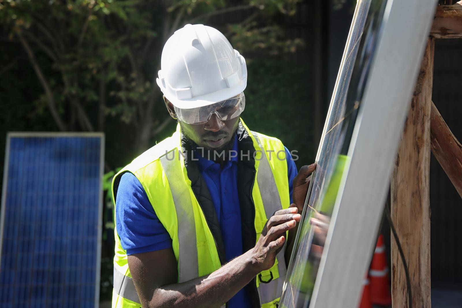 maintenance engineer, Solar energy systems engineer perform analysis solar panels, Portrait of engineer man or worker, people, with solar panels or solar cells on the roof in farm. Power plant with green field, renewable energy source in American. Eco technology for electric power.