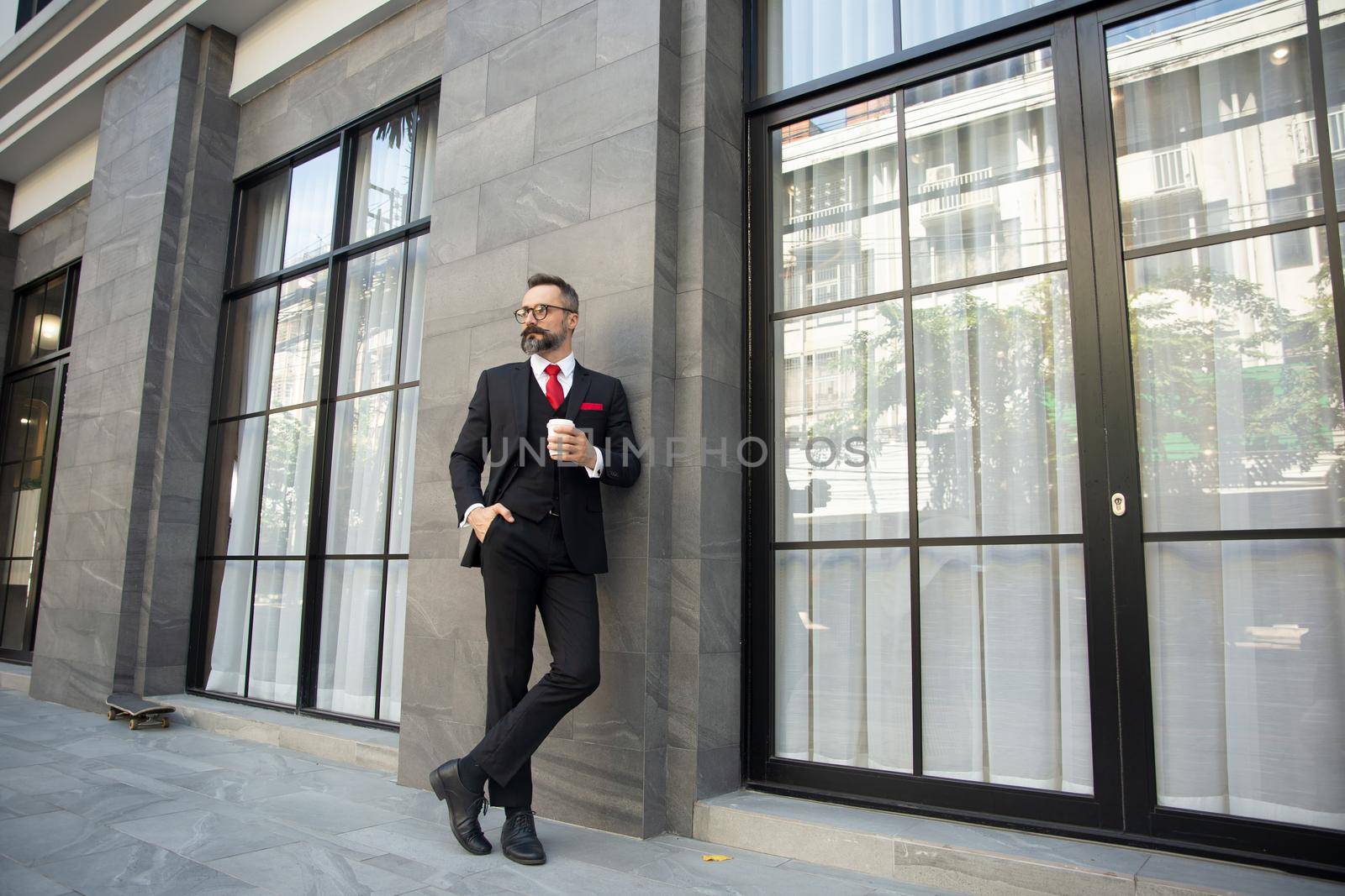 Bearded mature man standing at the street