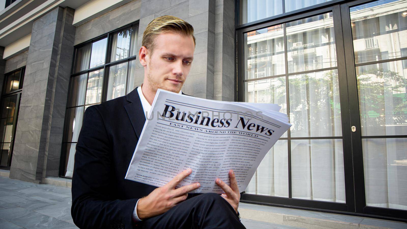 business people reading business newspaper at outdoor.
