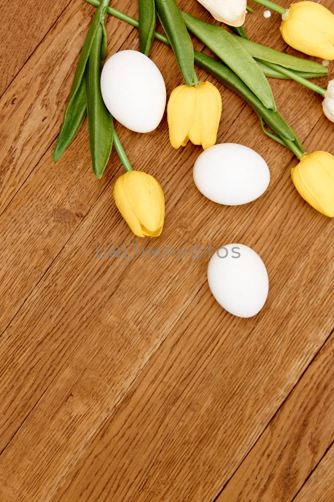 bouquet of flowers chicken eggs wooden background Copy Space Easter. High quality photo