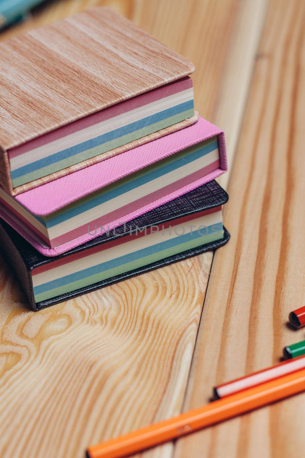 colorful notepads office wooden table paper work is education. High quality photo